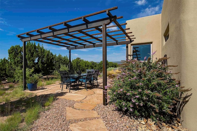 view of patio / terrace featuring outdoor dining space and a pergola