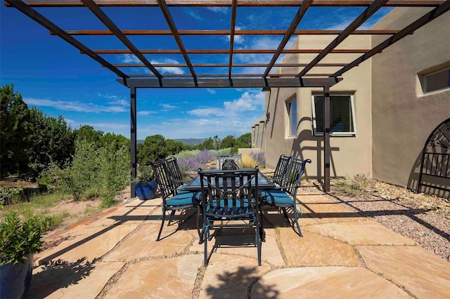 view of patio / terrace with outdoor dining space and a pergola