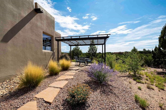 view of patio featuring a pergola