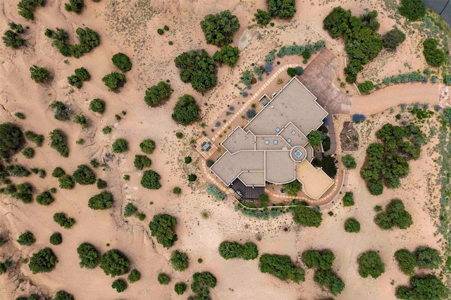 birds eye view of property with a desert view