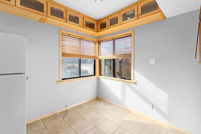 empty room with light tile patterned floors