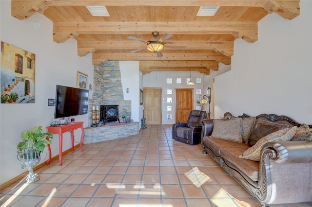 living room featuring ceiling fan, light tile patterned floors, wooden ceiling, and beam ceiling