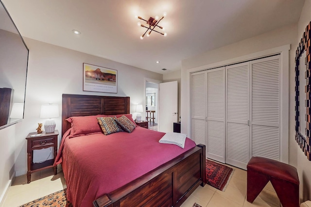 tiled bedroom featuring a closet