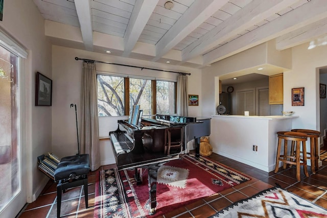 miscellaneous room featuring beamed ceiling, wood ceiling, and dark tile patterned flooring