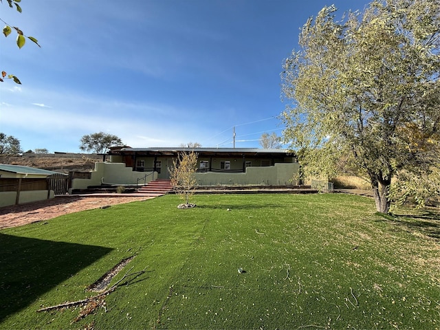 exterior space with a front lawn