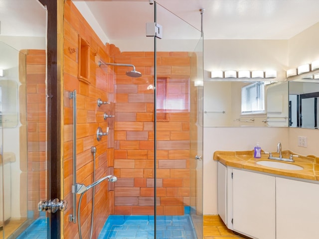 bathroom featuring a stall shower and vanity