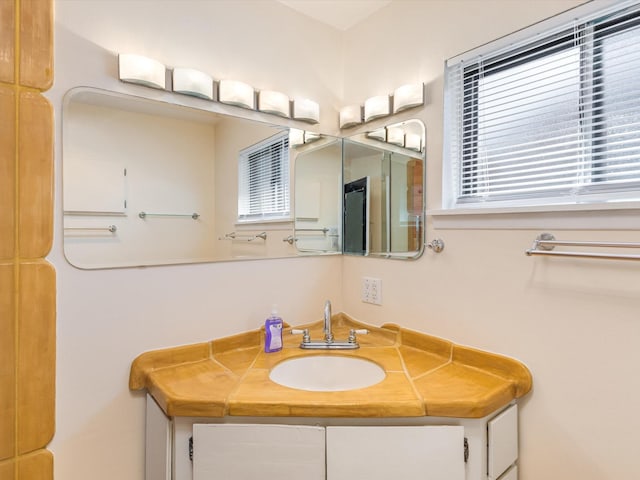 bathroom featuring plenty of natural light and vanity