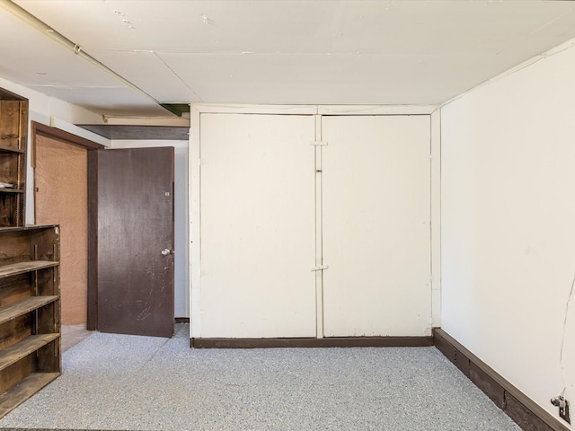 empty room featuring baseboards