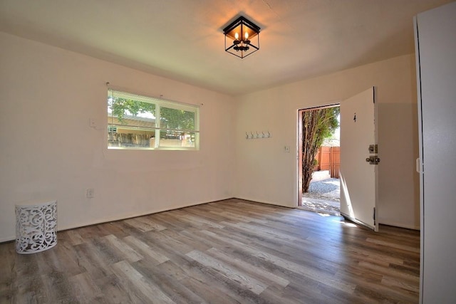 spare room featuring hardwood / wood-style flooring