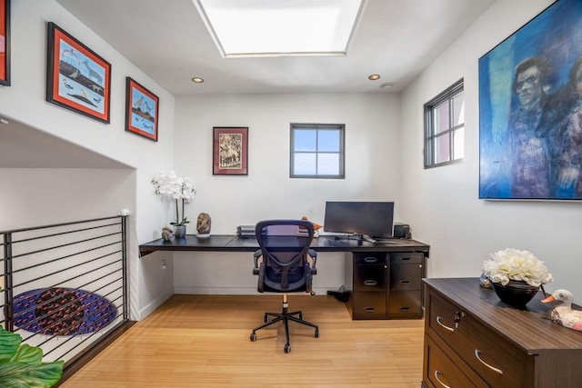 office space with light wood-type flooring