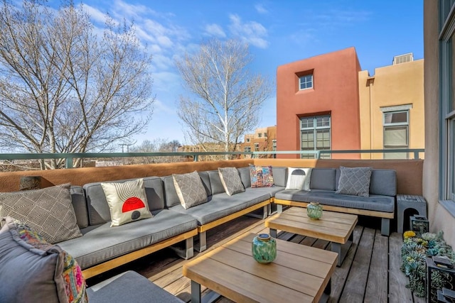 wooden terrace featuring an outdoor hangout area