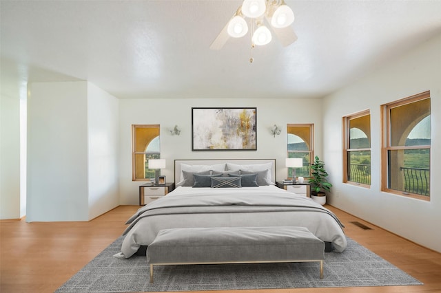 bedroom featuring ceiling fan and light hardwood / wood-style flooring