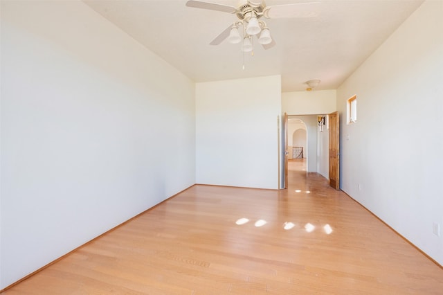 empty room with light hardwood / wood-style floors and ceiling fan