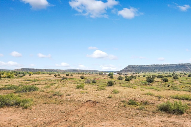 view of mountain feature with a rural view