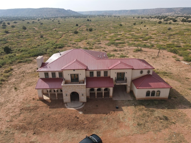 birds eye view of property featuring a mountain view