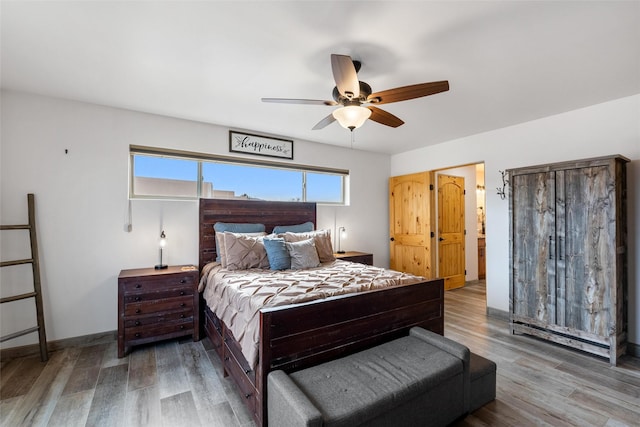 bedroom featuring hardwood / wood-style floors and ceiling fan