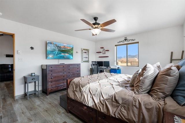 bedroom featuring ceiling fan and hardwood / wood-style floors