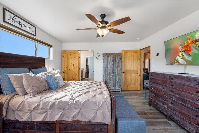 bedroom with hardwood / wood-style flooring and ceiling fan