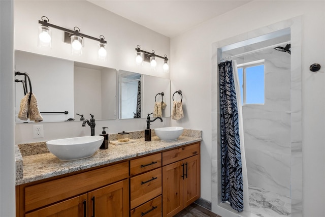 bathroom featuring a shower with curtain and vanity