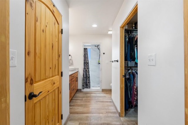 hallway featuring light hardwood / wood-style flooring