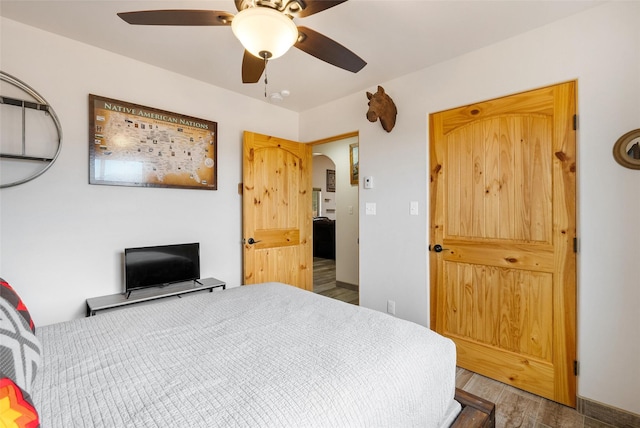 bedroom featuring hardwood / wood-style flooring and ceiling fan