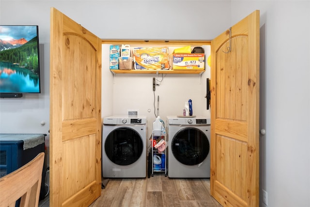 washroom featuring separate washer and dryer and hardwood / wood-style floors