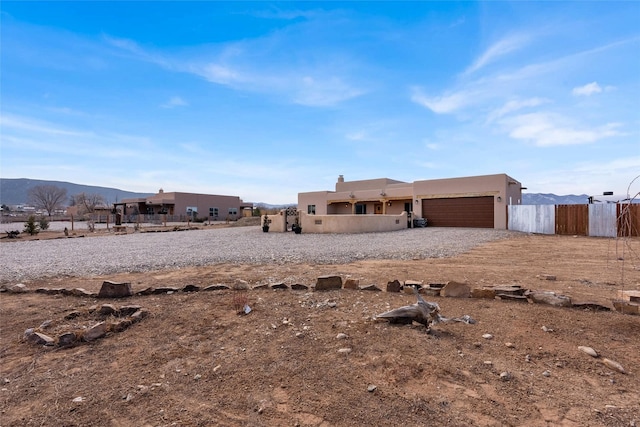 exterior space featuring a mountain view and a garage