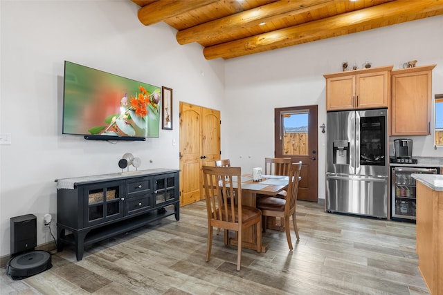 dining area with beamed ceiling, wooden ceiling, wine cooler, and light wood-type flooring