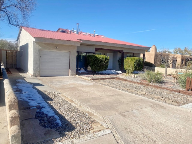 ranch-style home with a garage