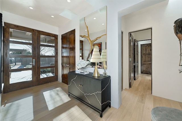 entryway with french doors and light wood-type flooring