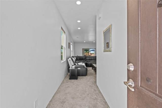 corridor with light colored carpet