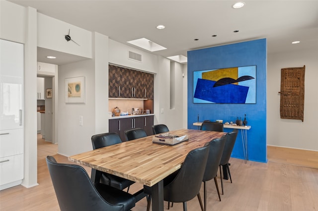 dining room with light wood-type flooring