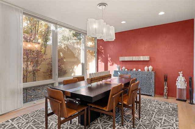 dining space with hardwood / wood-style flooring