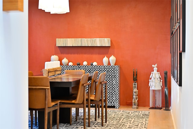 dining room with wood-type flooring