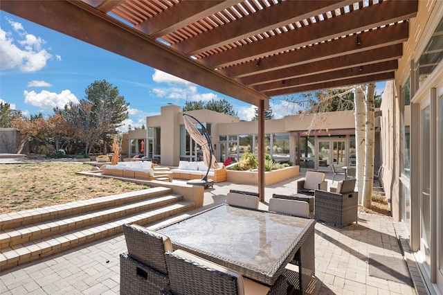 view of patio / terrace featuring a pergola and an outdoor hangout area