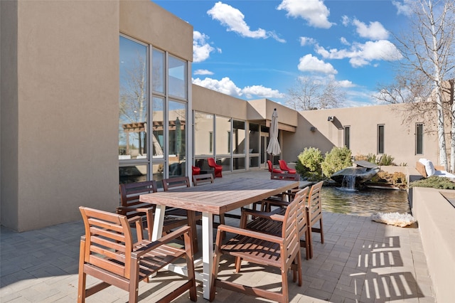 view of patio featuring a water view