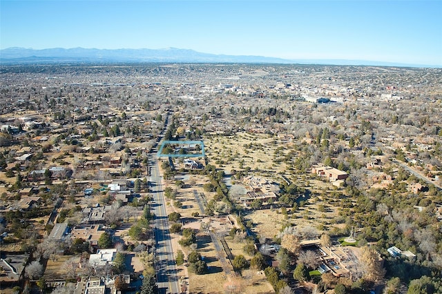 birds eye view of property featuring a mountain view