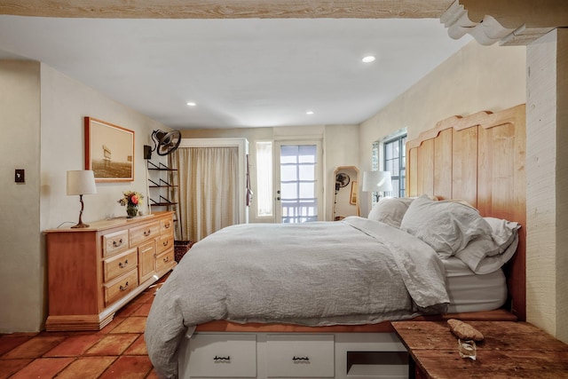 bedroom with access to outside, light tile patterned flooring, and recessed lighting