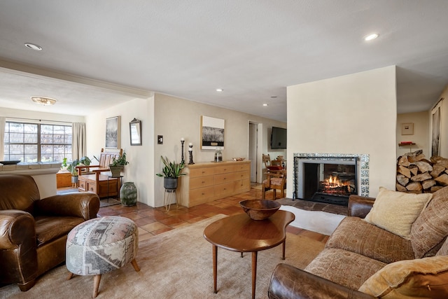 living room featuring recessed lighting, light tile patterned flooring, and a multi sided fireplace