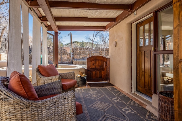 sunroom with wooden ceiling and beamed ceiling