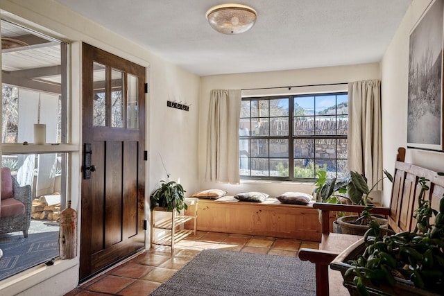 entryway featuring a textured ceiling