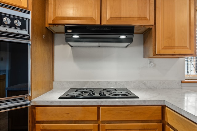 kitchen featuring extractor fan and black appliances