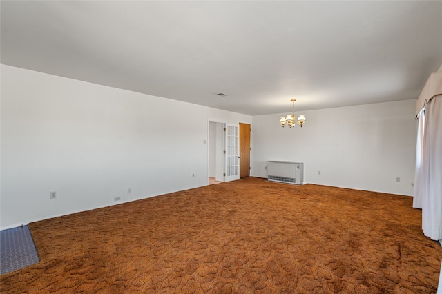 unfurnished living room with carpet and an inviting chandelier