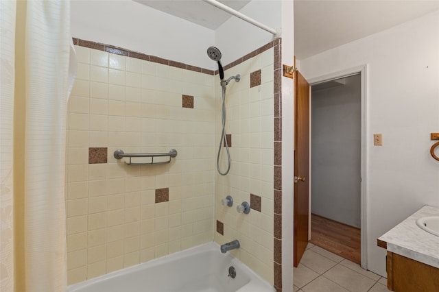 bathroom featuring tile patterned flooring, vanity, and shower / bath combo with shower curtain