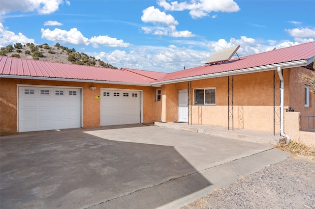 single story home with a garage