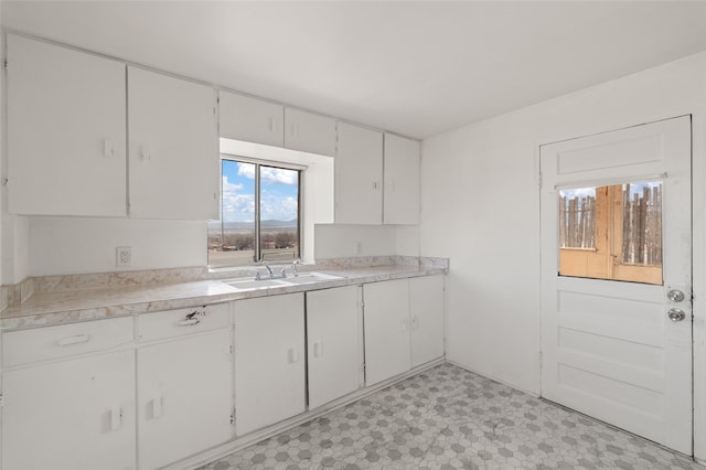 kitchen with sink and white cabinets