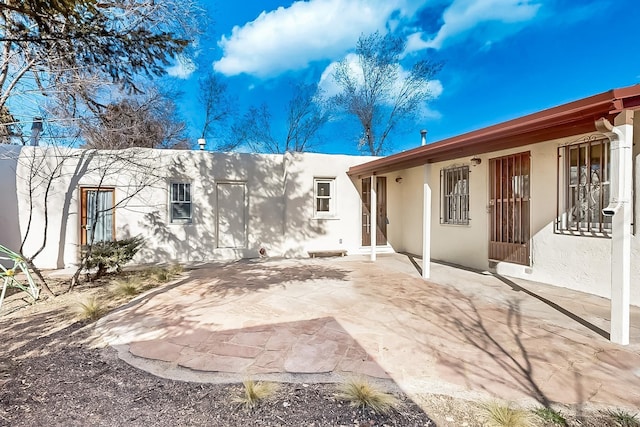 rear view of property with a patio area