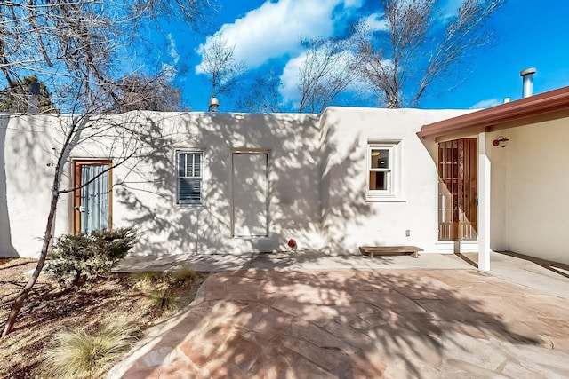 view of home's exterior featuring a patio