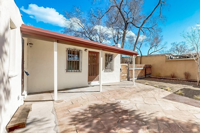 rear view of property featuring a patio area