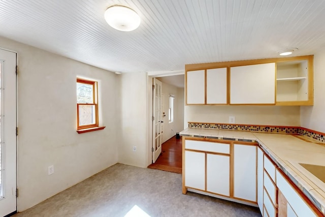 kitchen featuring white cabinets